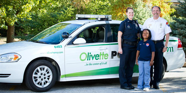 Chief Richard Knox and Officer Beth Davis of the Olivette Police Department participate in a local charity to help make children's dreams come true.